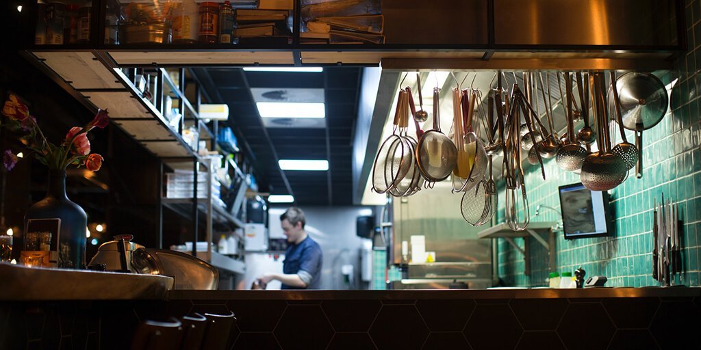Ghost kitchens: A chef preparing a meal.